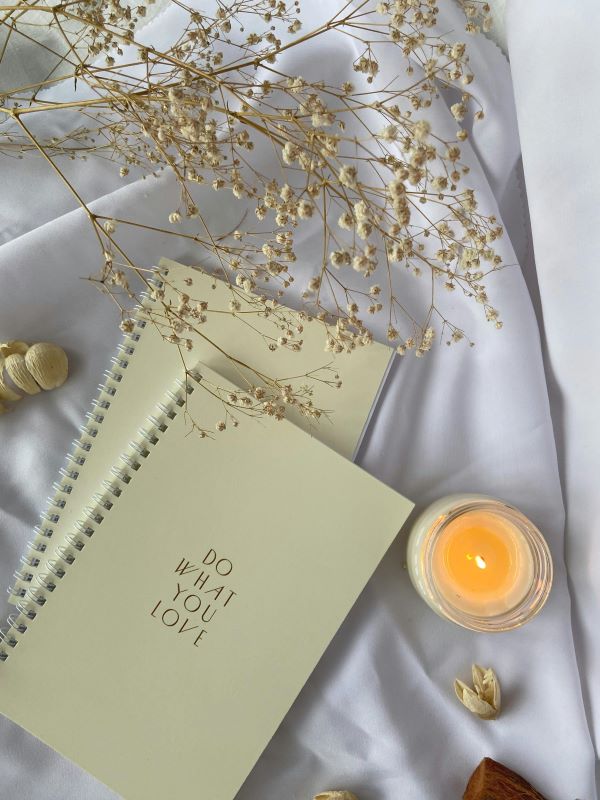 candle and journals