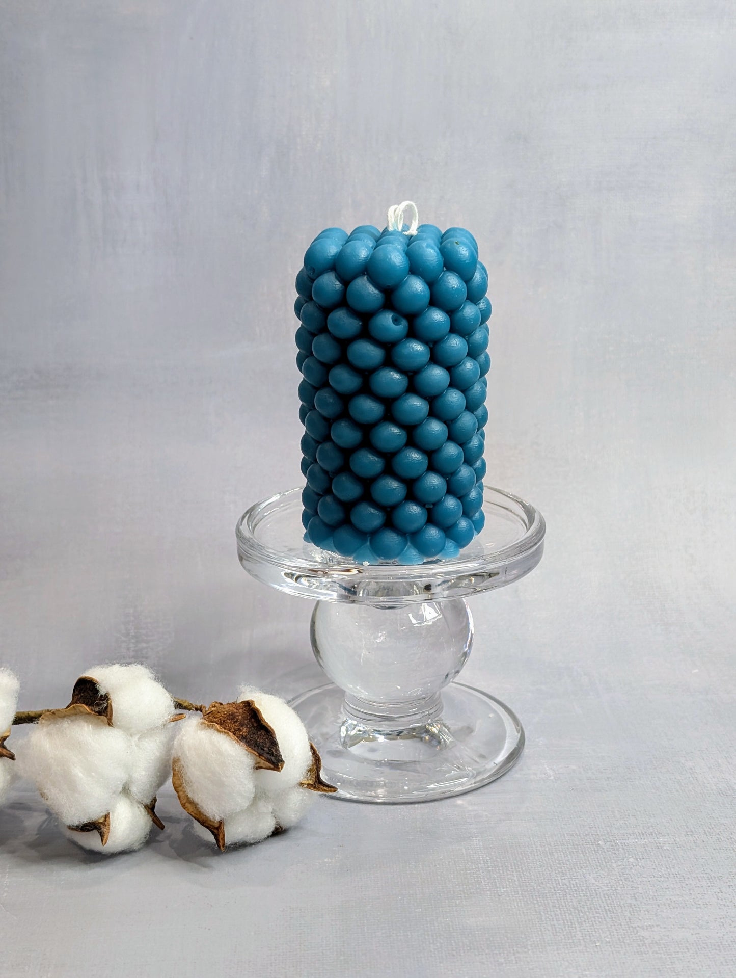 Blue bubbly candle