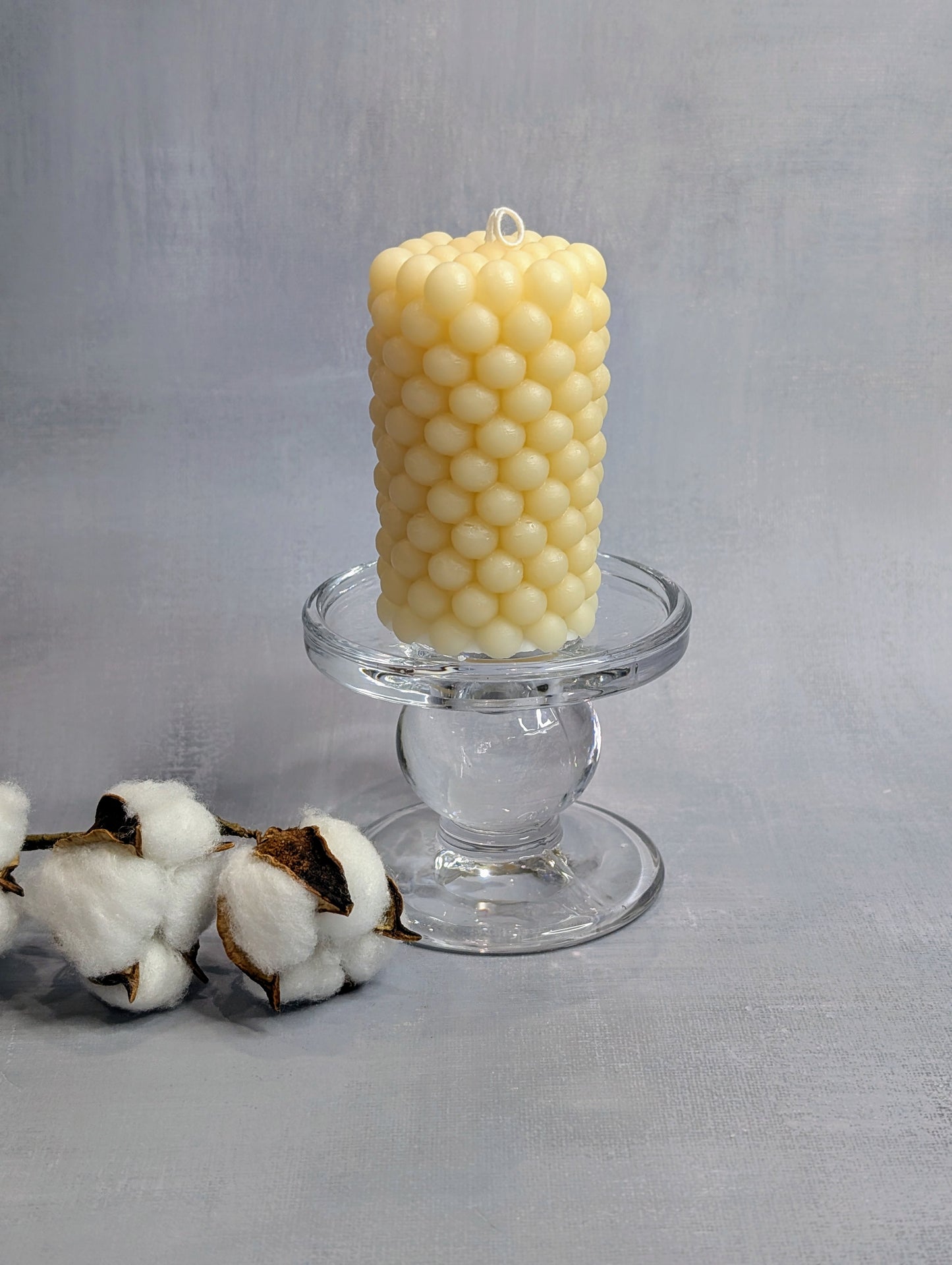 Beige bubbly candle