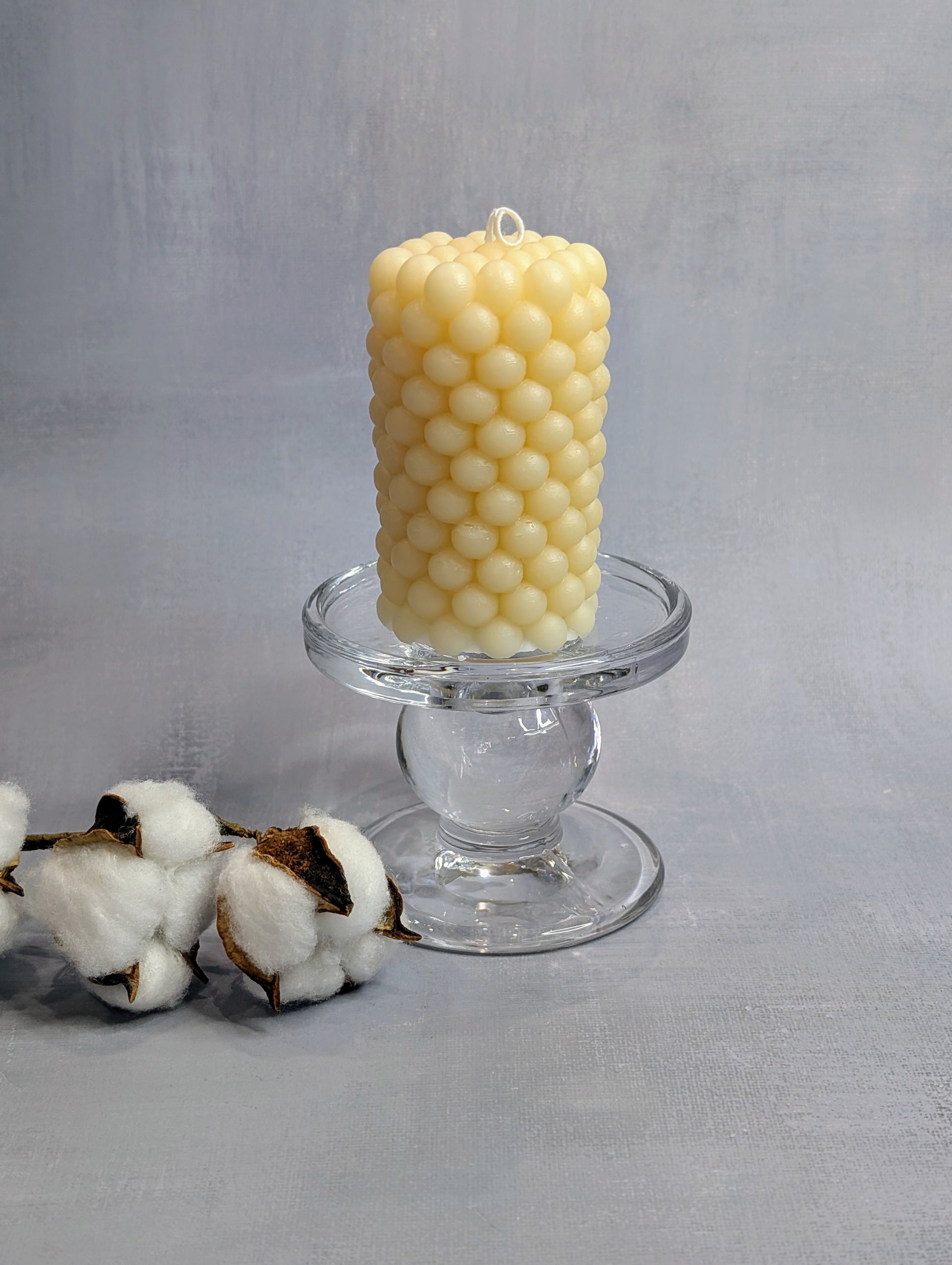 Beige bubbly candle